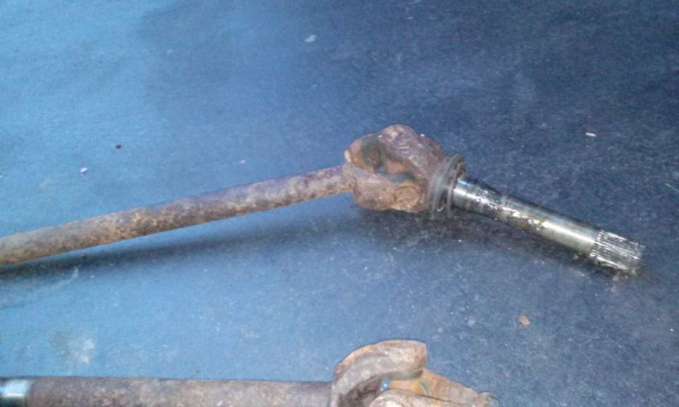 rusted drive shaft with u-joint and splined end