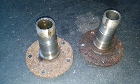 1994 Ford Bronco - Pair of used wheel hubs, showing rust and wear on the mounting flanges.