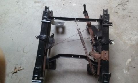 1994 Ford Bronco - This is a seat frame, not a complete vehicle, and no year is discernible from the image.