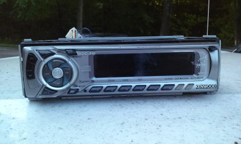 1994 Ford Bronco - Kenwood KDC-319 car stereo unit shown with its display and control buttons visible.