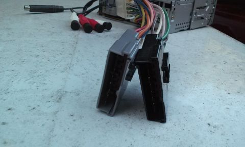 1994 Ford Bronco - Car stereo wiring harness with RCA connectors and a power adapter is shown.