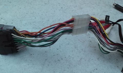 1994 Ford Bronco - Wiring harness with RCA connectors, likely for an aftermarket car stereo installation.