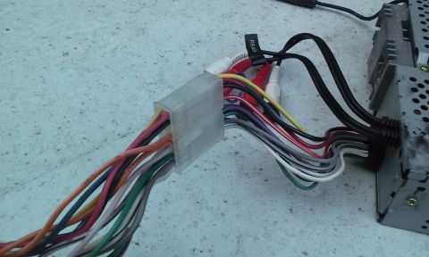 1994 Ford Bronco - Wiring harness and RCA connectors for a car stereo system are shown.