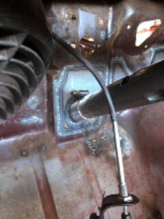 1964 Ford Fairlane - Interior view of a car's firewall, showing a cable assembly.
