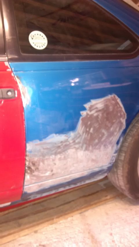 1994 Ford Thunderbird - This vehicle is undergoing body repairs, with visible filler on the side panel.