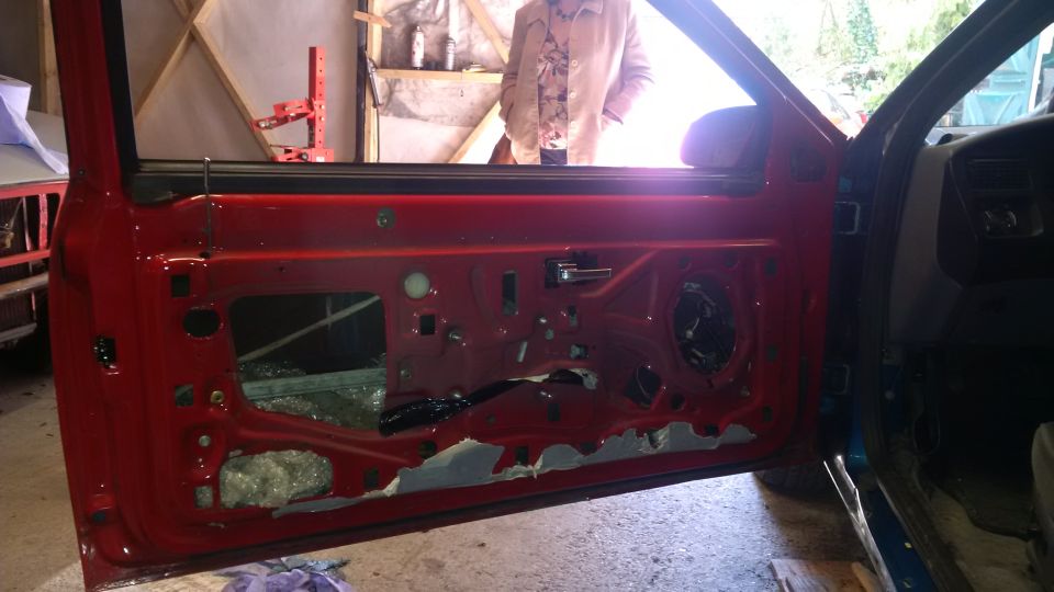 1994 Ford Thunderbird interior, red door panel removed