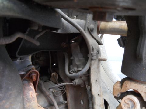 1992 Ford Bronco - Undercarriage view of a 1992 Ford Bronco, highlighting suspension and brake system parts.