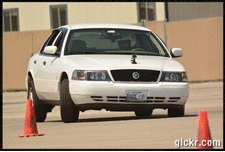 2000 Mercury Grand Marquis - A white sedan navigates a course marked by traffic cones.