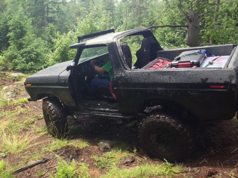 1979 Ford Bronco - This black 1978 Ford Bronco is equipped for off-roading and is seen in a wooded area.