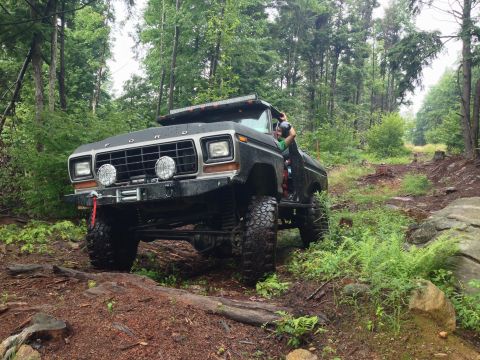 1979 Ford Bronco - This lifted 1979 Ford Bronco tackles a challenging off-road course through a dense forest.