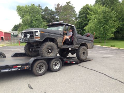 1979 Ford Bronco - This lifted black 1979 Ford Bronco is being loaded onto a trailer.