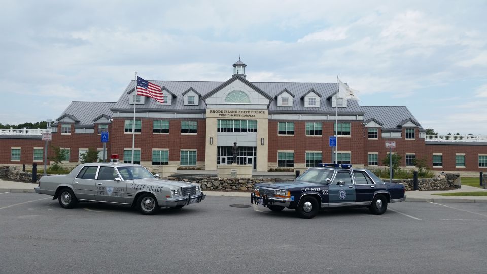Two Rhode Island State Police cars parked in front of the State Police Public Safety Complex