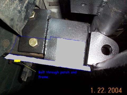 1992 Ford Bronco - Close-up of a custom bumper bracket installation, showing bolts securing it to the frame.