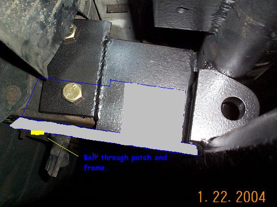 Welded steel frame repair patch bolted to a truck frame rail, annotated "Bolt through patch and frame"