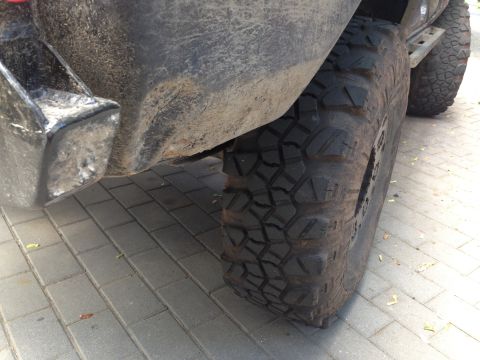 1979 Ford Bronco - Close-up view of a vehicle's rear bumper and tire, with "SUPERMOTORS.NET" visible at the bottom.