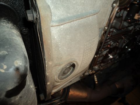 2004 Mercury Grand Marquis - Underside view of a vehicle's transmission and exhaust system, showing various mechanical components.