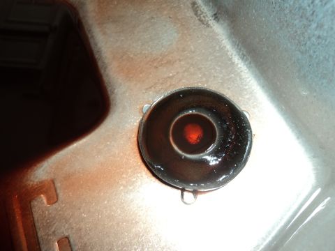 2004 Mercury Grand Marquis - Transmission fluid dipstick shows dark red fluid with a small reflection.