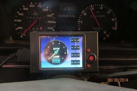 1985 Volkswagen GTI - Interior view of a car dashboard, displaying analog and digital gauges.