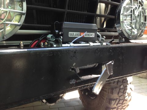 1979 Ford Bronco - Front bumper assembly with winch and auxiliary lights, showing a "Badland Winches" label.