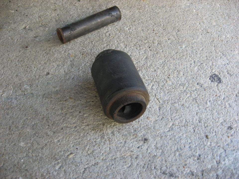 Leaf spring bushing and metal sleeve on concrete