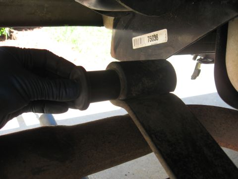 1994 Ford Bronco - Replacing a leaf spring bushing on a vehicle's suspension system.