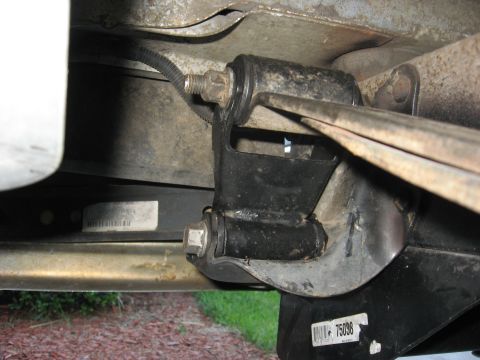 1994 Ford Bronco - Close-up view of a leaf spring bushing, a component of the vehicle's suspension system.