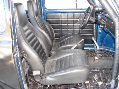 1964 Volkswagen Beetle - Modified interior of a 1964 Volkswagen Beetle with racing seats and roll cage.
