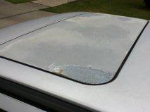 1985 Volkswagen GTI - Close-up of a weathered white sunroof showing signs of paint damage and corrosion.