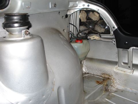 1985 Volkswagen GTI - Close-up view of a car's interior, revealing mechanical components and signs of wear.