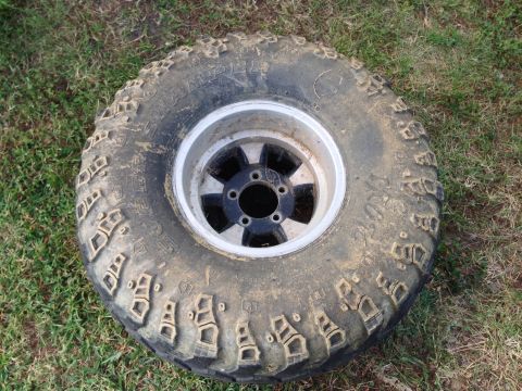 1979 Ford Bronco - This is a close-up of an off-road tire and rim, not a 1979 Ford Bronco.