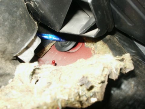 1998 Mercury Sable - Detail of automotive interior showing wiring and insulation, possibly related to a repair or modification.