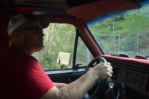 1983 Ford Bronco - Driver's perspective from inside a vehicle, showing the steering wheel and dashboard.