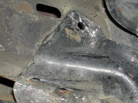 1996 Ford Bronco - All three rivets on the driver's side brack have been removed.