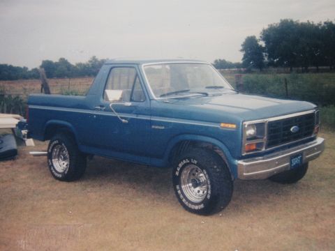 1982 Ford Bronco - This 1982 Ford Bronco is shown from the front three-quarter view, parked on a grassy area.