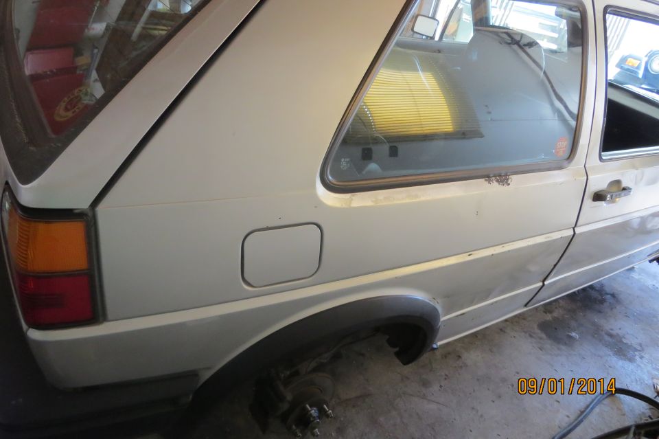 1985 Volkswagen GTI rear quarter panel and taillight. White hatchback