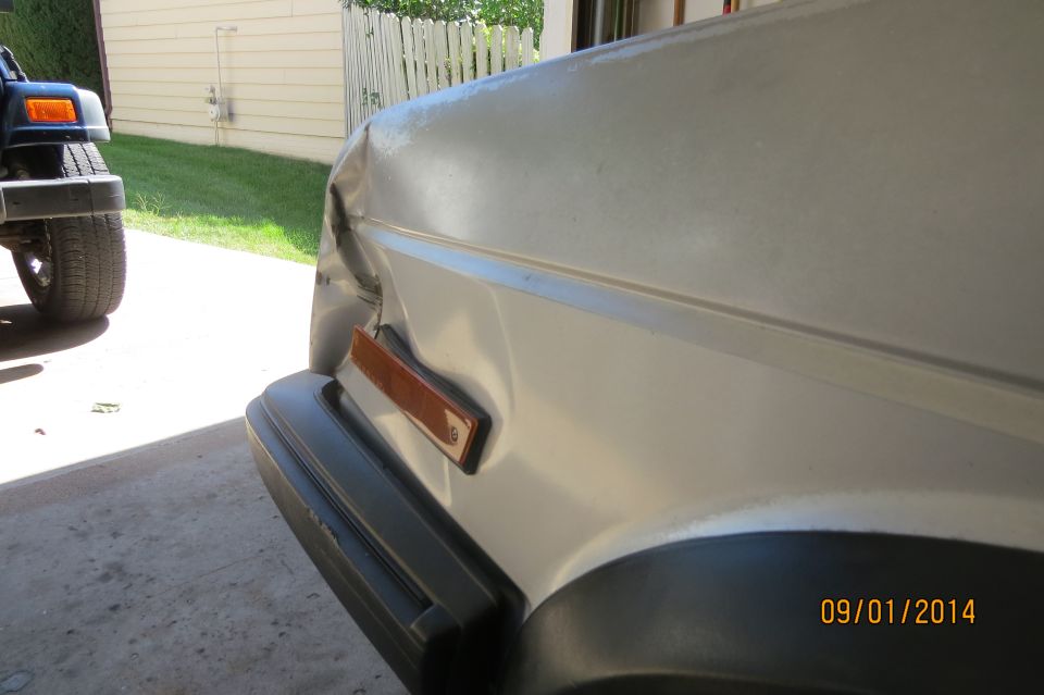 Close-up of a car's exterior door handle and part of the door panel