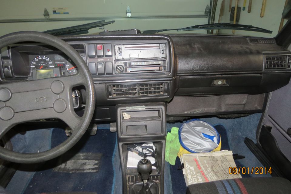 1985 Volkswagen GTI interior with dashboard, steering wheel, and center console visible