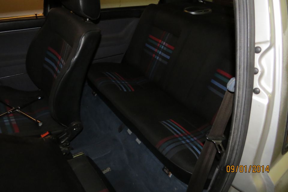 Back seat and front seat of a car with plaid fabric inserts