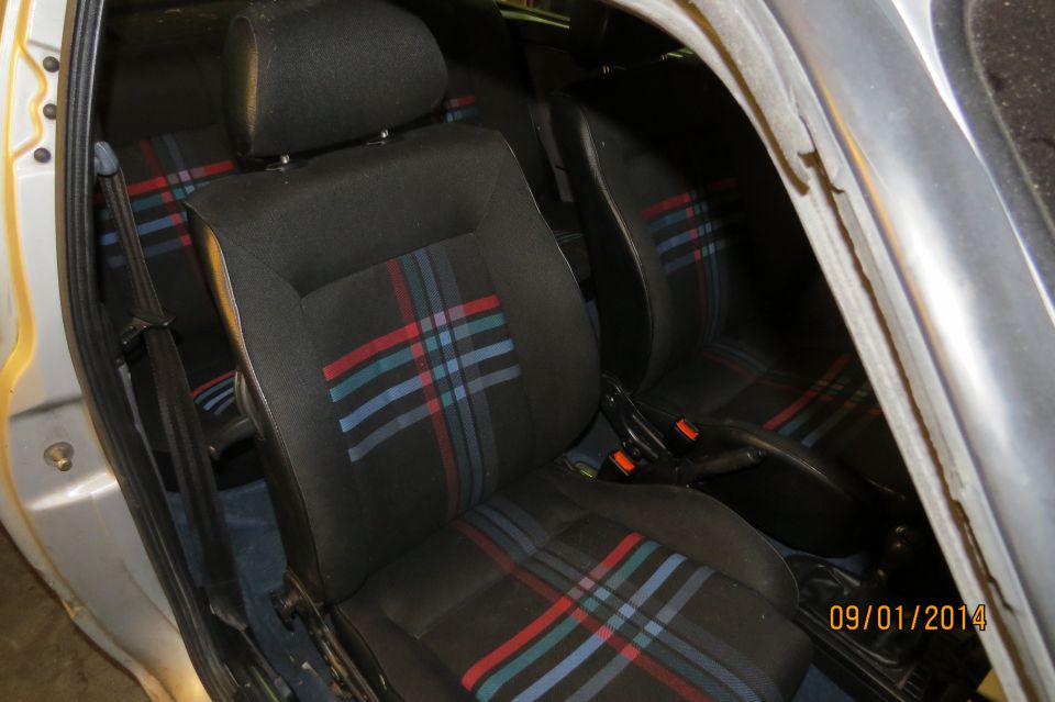 1985 Volkswagen GTI interior showing plaid seats and center console