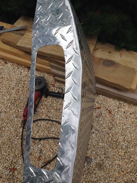 1979 Ford Bronco - A diamond plate metal part is shown outdoors with construction materials and tools.