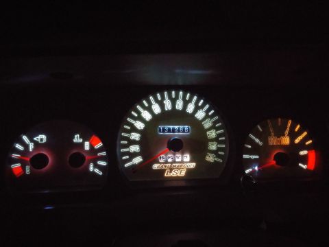 2000 Mercury Grand Marquis - The illuminated dashboard gauges display the odometer reading and model designation.