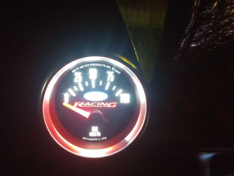 2000 Mercury Grand Marquis - An Auto Meter Products Inc. racing gauge displays oil pressure with a red needle pointing towards 20 PSI.