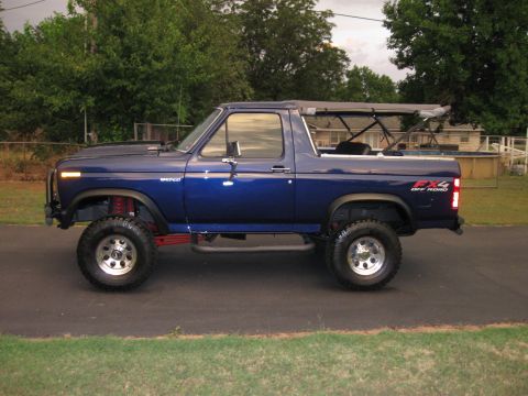 1982 Ford Bronco - This 1982 Ford Bronco is shown in a side profile with its soft top removed, revealing the interior structure.