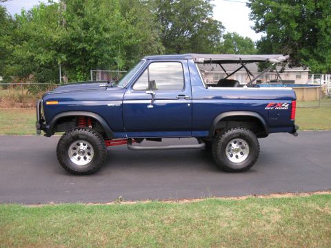 1982 Ford Bronco - 1982 Ford Bronco seen from the side, a lift kit and FX4 Off Road badging.