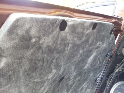 1980 Ford Mustang - Close-up of the underside of a car's hood, showing the insulation pad.