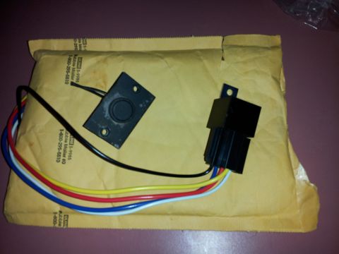 1976 Ford Ranchero - A black air conditioning relay and switch with colored wires are shown on a padded envelope.