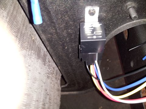 1976 Ford Ranchero - Close-up of an automotive relay and its wiring harness, likely part of a vehicle's electrical system.