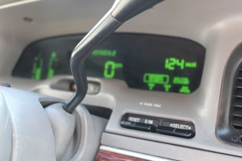 2002 Mercury Grand Marquis - The digital dashboard of a 2002 Mercury Grand Marquis displays the speed at 0 mph and a trip odometer reading of 124 miles.