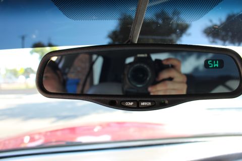 2002 Mercury Grand Marquis - The rearview mirror reflects a camera and a digital display, with a watermark at the bottom.
