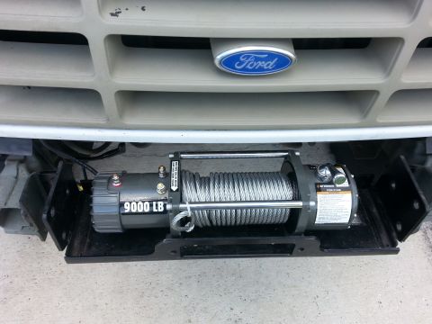 1992 Ford Bronco - Front view of a 1992 Ford Bronco, a 9000 LB winch installed below the grille.